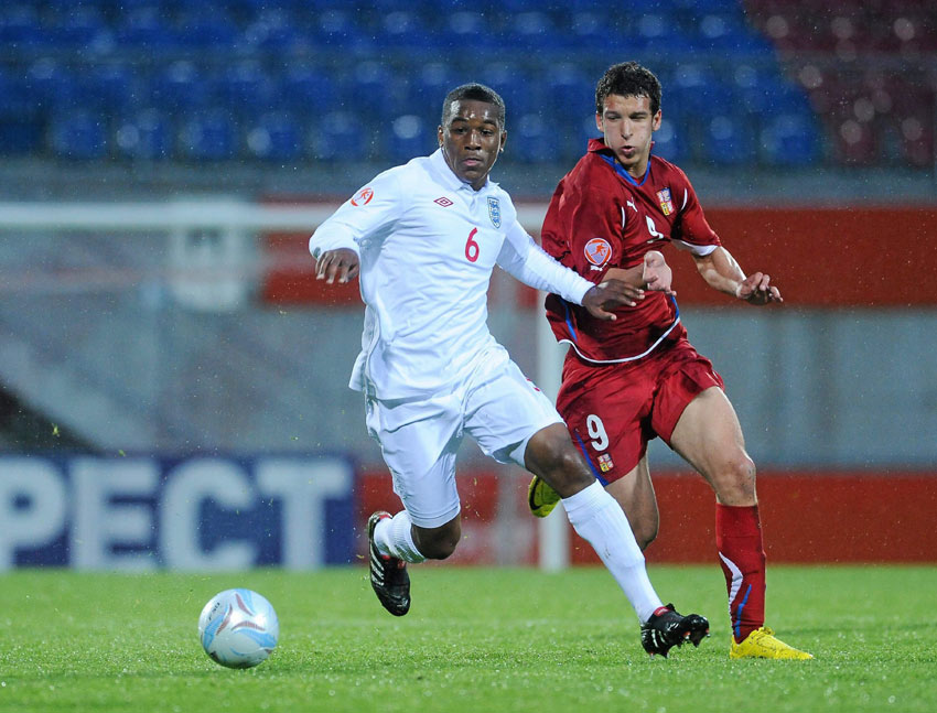 Andre Wisdom holds off Czech Republic forward Dominik Mandula (image courtesy of Sportsfile).